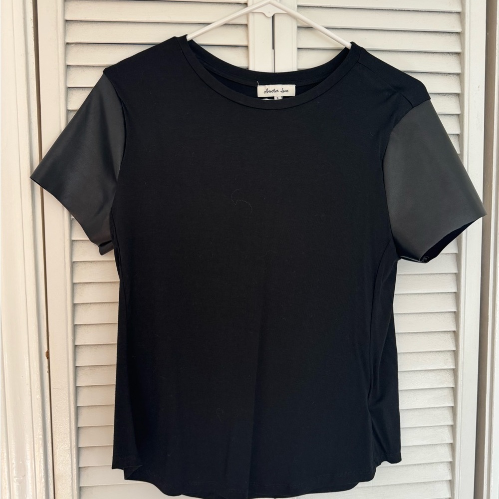 Cute black, dressy tea with faux leather sleeves